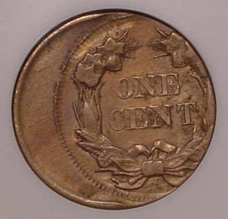 1897 Indian Head Penny off-center strike error showing design shifted off-center with visible unstruck planchet area at the edge